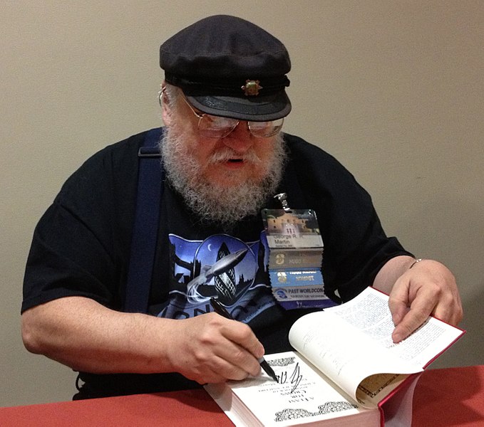 679px-George_R._R._Martin_signing_at_LoneStarCon3.jpg